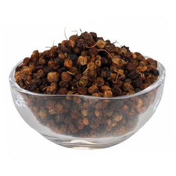 a close up of a bowl of food on a table