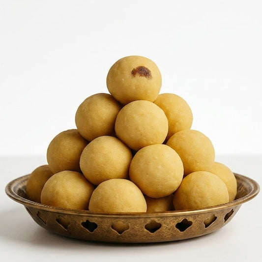 Six pieces of Kaipunnyam Maladu snacks, crispy and golden, displayed on a plate showing traditional Indian sweet treats.