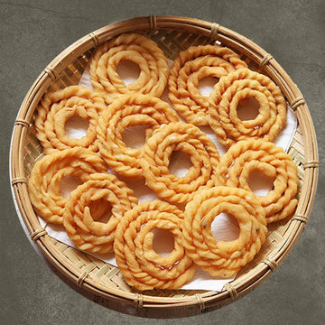 a golden clock on top of a glass plate 