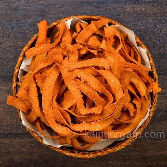a close up of an orange frisbee on a table 