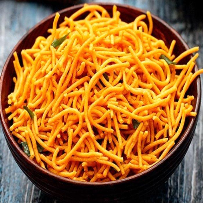 a bowl of noodles and carrots in a bowl 